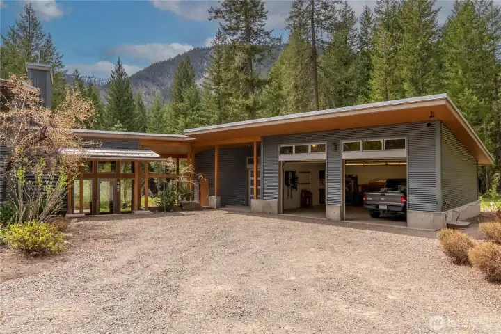 In addition to the large garage, there is lots of room for guest parking in the gravelled entry.