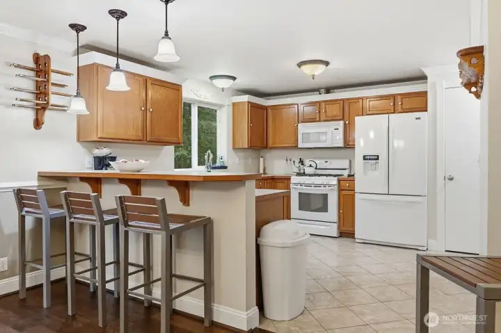 Gas range, lots of cabinets and countertops. Eating bar and pantry, this kitchen is great for gourmet cooking and quick and easy meals.