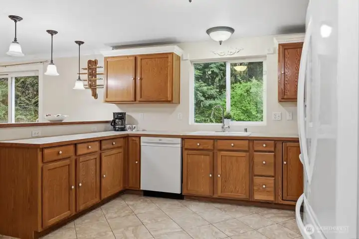 There's lots of privacy just outside this kitchen window. The home backs up to a greenbelt.