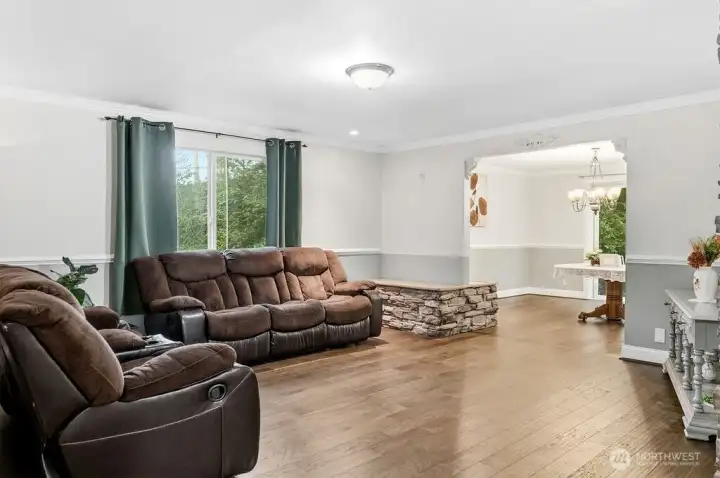 The living room and archway to dining room.