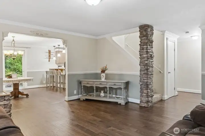 The living room opens to the dining room and the eating bar in the kitchen.