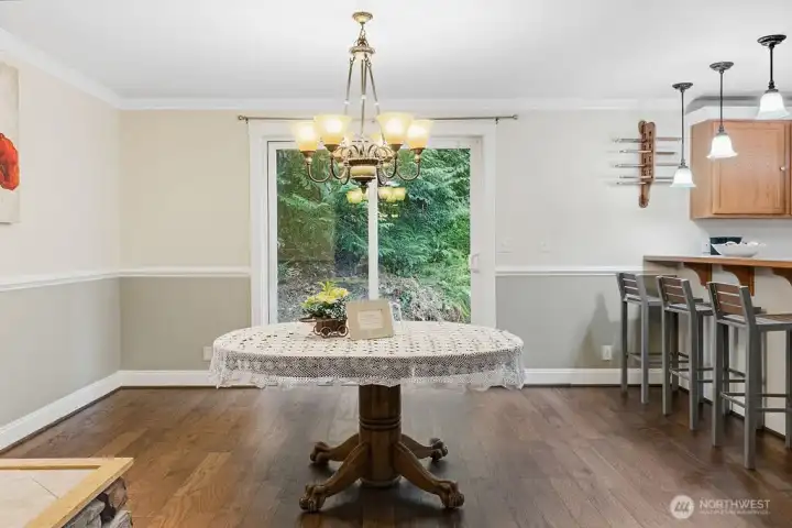 The dining room. This door opens out to the back yard with greenbelt beyond.