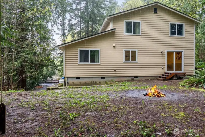 The backyard with firepit.