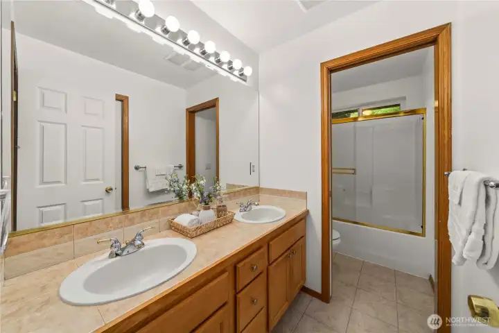 Hall Full Bath with Double Sinks.