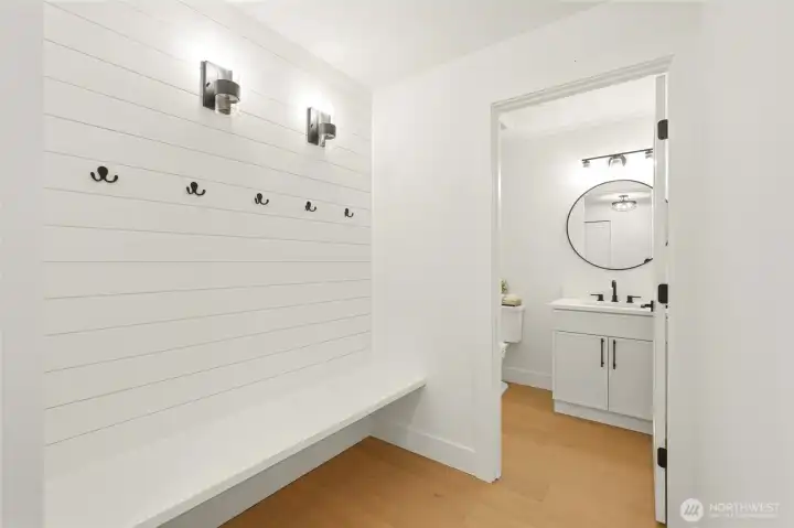 Thoughtfully designed mudroom with bench seating, hooks, and stylish everyday function.