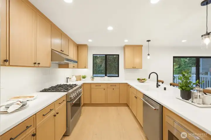 Designer kitchen with quartz surfaces, sleek finishes, and a bright, functional layout.