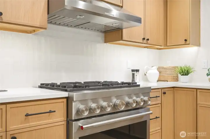 Elevated appliance package and designer details complete the fully renovated kitchen.