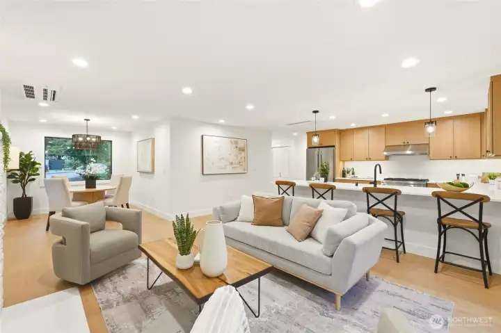 Beautifully staged great room highlights the home’s open layout and renovated design.