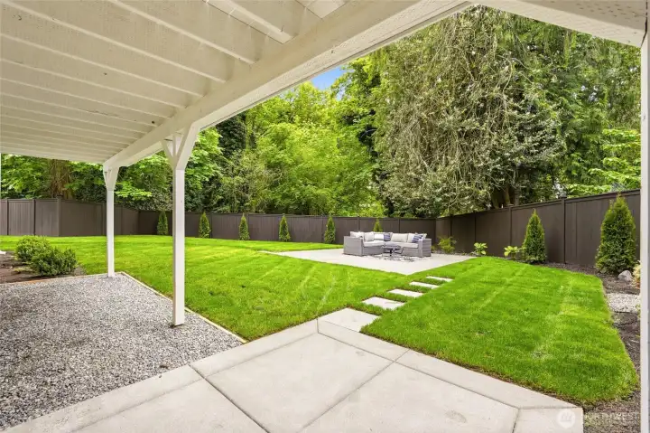 Covered patio and backyard access create an easy indoor-outdoor connection from the lower level.