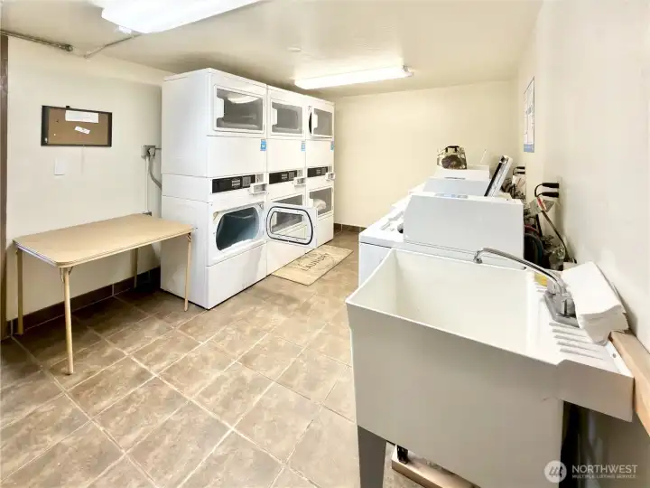 Laundry room is super conveniently in the building right accross from you.