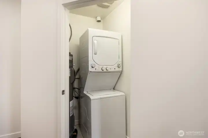 Washer dryer in closet with brand new hot water heater.