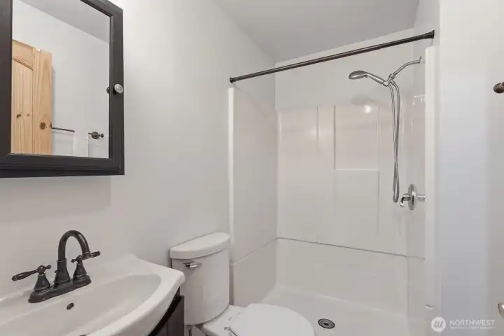 Back inside for one of two downstairs bathrooms...