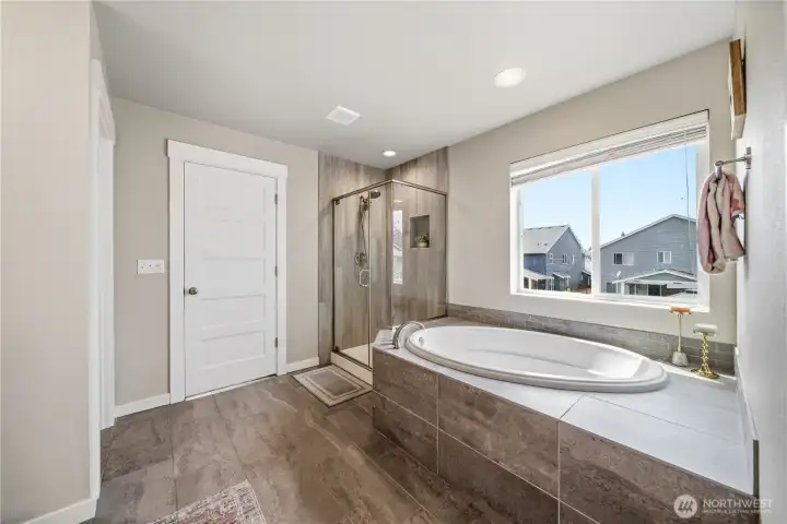 Imagine soaking away the stress of the day in the spacious shower or soaker tub