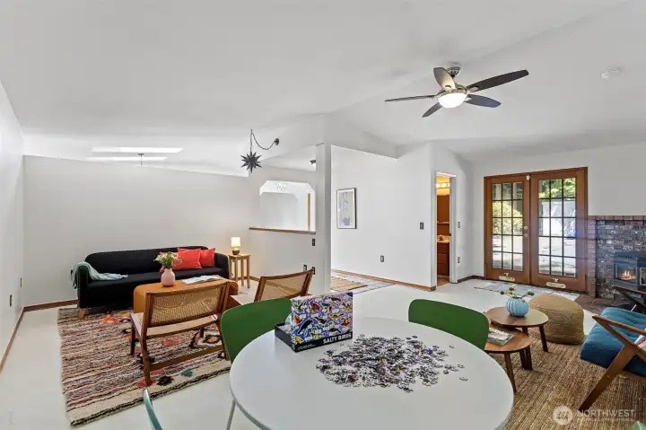 Rec room with adjacent 3/4 bath and French doors leading out to pool area.
