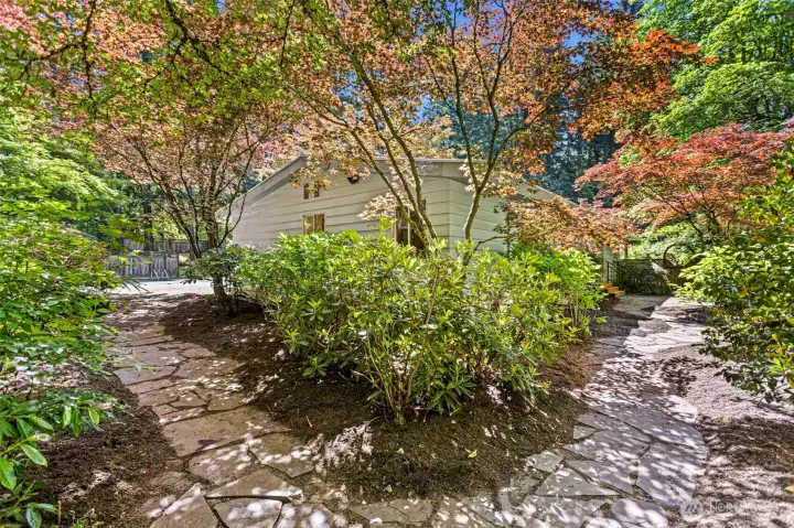 Montana slate stone pathways leading to pool on the left and kitchen patio the right.