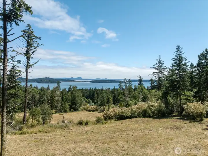 Beautiful marine island and mountains views from this 5 acres with cleared building site ready for your ideas.