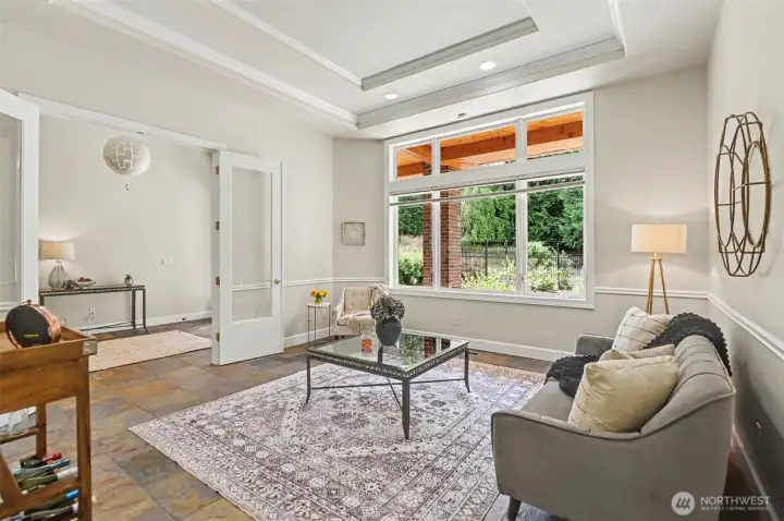 The front room to the left of the entry with tray ceiling is a beautiful space to entertain guests or enjoy the view of the front garden The front room to the left of the entry with tray ceiling is a beautiful space to entertain guests or enjoy the view of the front garden