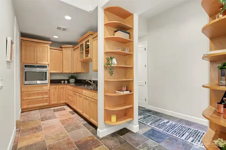 Butler's pantry with second oven, prep sink and access to huge walk-in pantry. Butler's pantry with second oven, prep sink and access to huge walk-in pantry.
