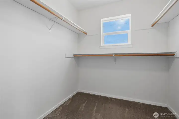 Primary walk-in closet Primary walk-in closet