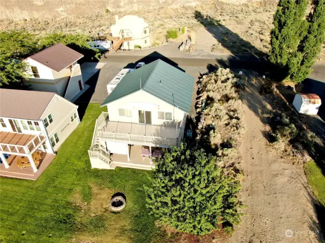 Aerial view of grassy back yard.