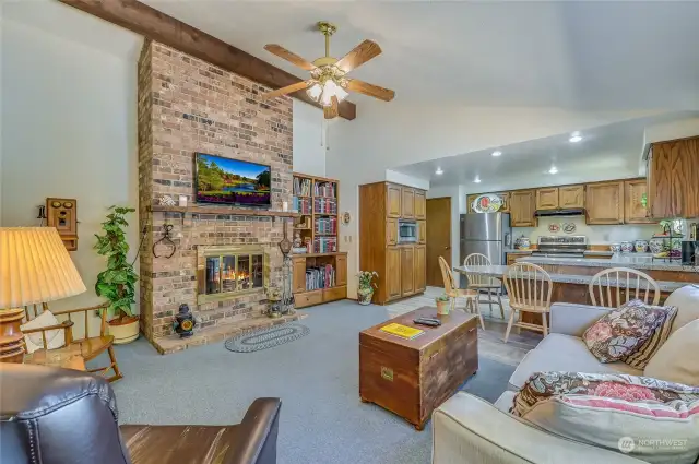 Enter to the light-filled Great Room with wood burning fireplace, open to the updated kitchen with eating space.