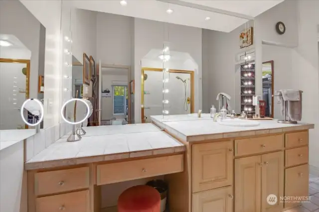 Movie Star Vanity with Dimmable Lighting, Solid Brass Fixtures, Glass Pulls, Medicine Cabinet with Hidden Pull and Mirrors in and out. Far Right is the Entry to the 2nd Primary Walk-In Closet.