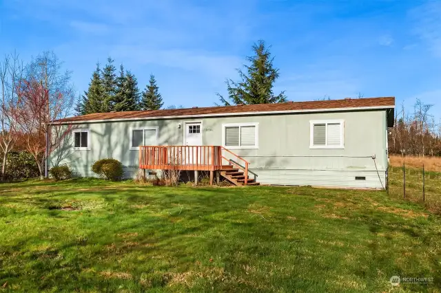 bright and spacious double-wide manufactured home, beautifully updated and set on a private acre with breathtaking Cascade views.