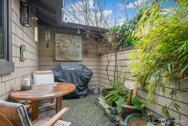 The patio area provides a small outdoor dining area for those times when less is more. The BBQ here is tight-lined to the home's gas service and so no more mucking about with propane tanks. This Weber is always ready to fire up for outdoor cooking.