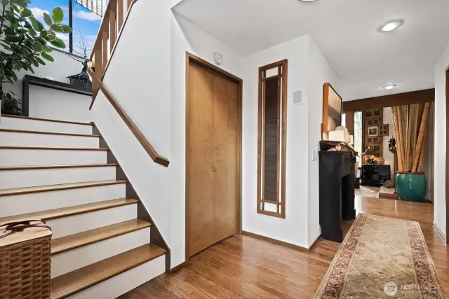 The entry landing has steps leading to a lovely stairway landing with a window for great light. The Conrad valance on this landing adds a touch of elegance.