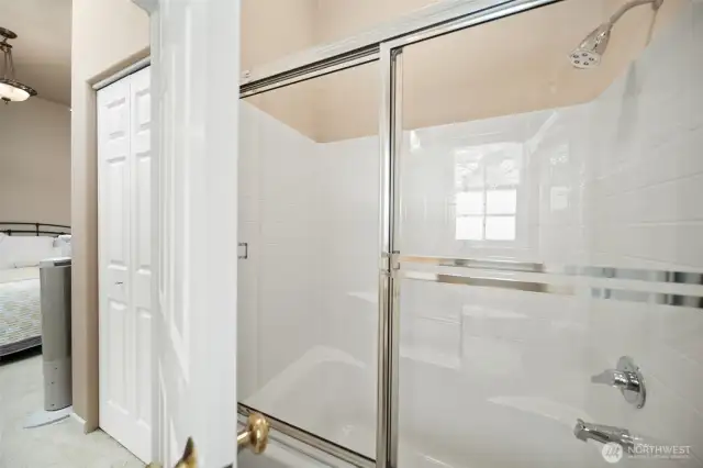 Primary bathroom with tub & shower.
