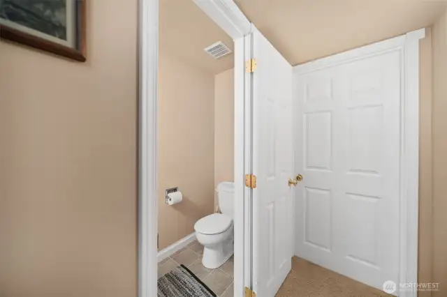 1/2 bathroom in the basement. Utility room and large storage area is straight ahead.