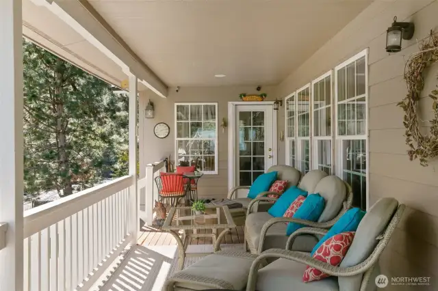 Covered deck with door to dining room & kitchen.
