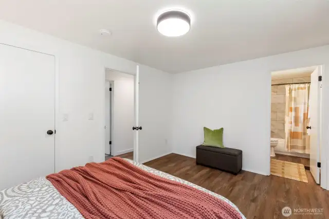 Another view of the primary suite into the bathroom.