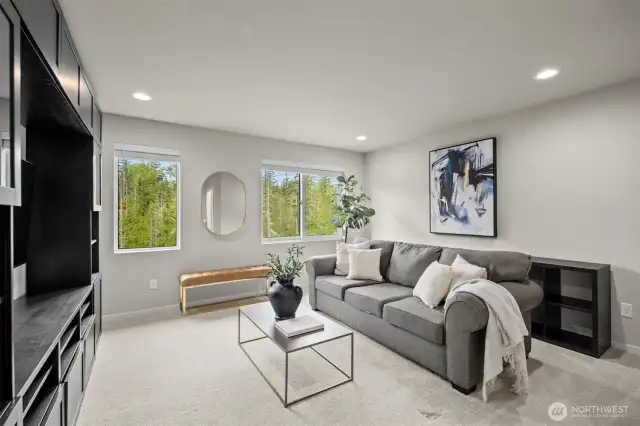 An additional upstairs bonus area offers the perfect space for entertaining, a second living room, or a play area—the choice is yours!