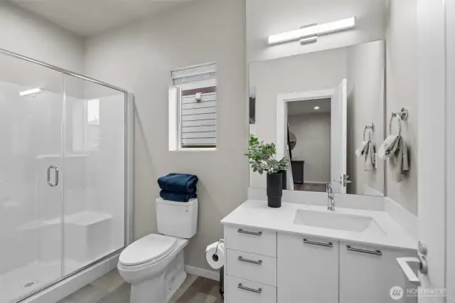 Main floor 3/4 bath makes it convenient for guests and multi-gen. living