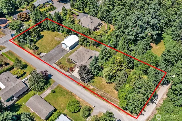 Single story, custom built home with attached 3 car garage, 1,180 sqft detached shop, on over 1 acre lot.