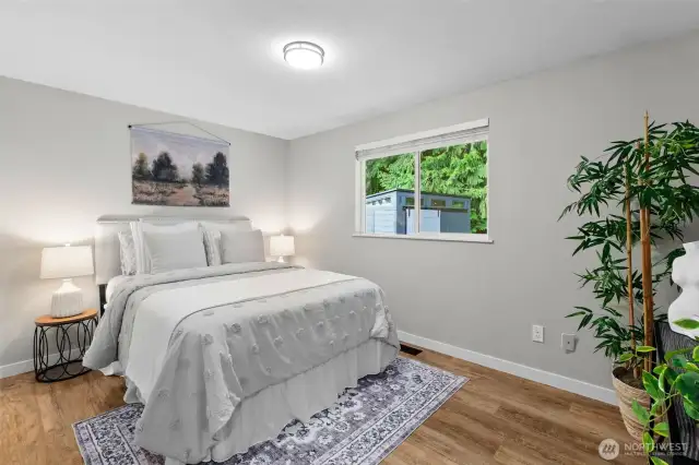 Bedroom #1- Closet to the left, windows offer views of the private backyard and wood blinds are found in each bedroom.