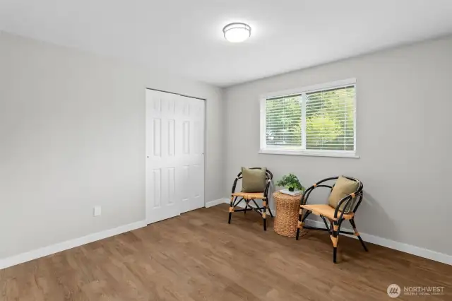 Bedroom #2 - Views of the lush front yard.  Full closet...