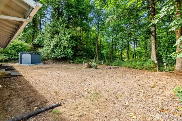 The cleared backyard is ready for topsoil & seed or hydroseed! A sizable garden shed has space to hold your lawn mower and other gardening equipment.
