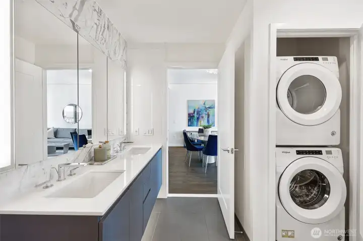 In-unit laundry is tucked in the bathroom.