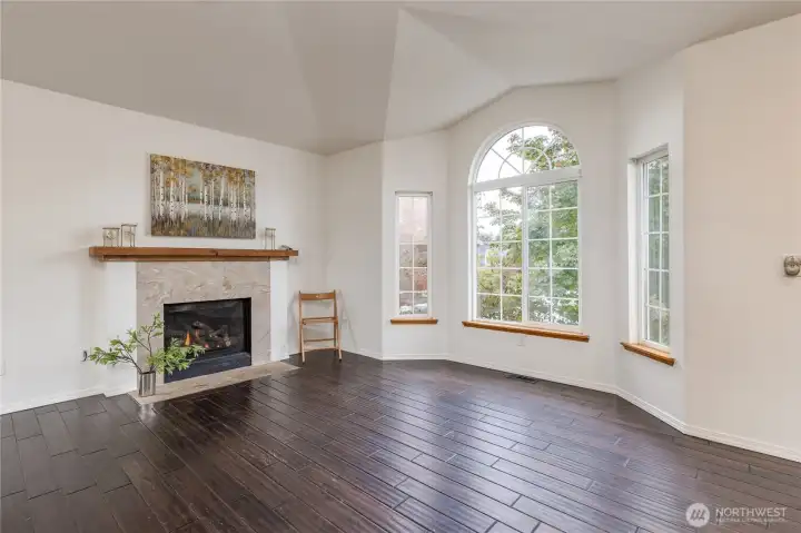 Living room has a beautiful gas fireplace and big picture windows