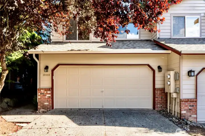 Front of home featuring two car attached garage.