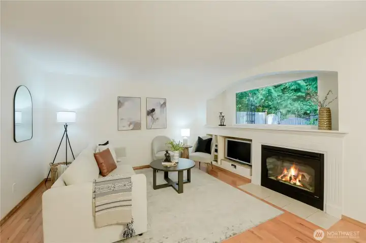 Gas fireplace and hardwood floors.