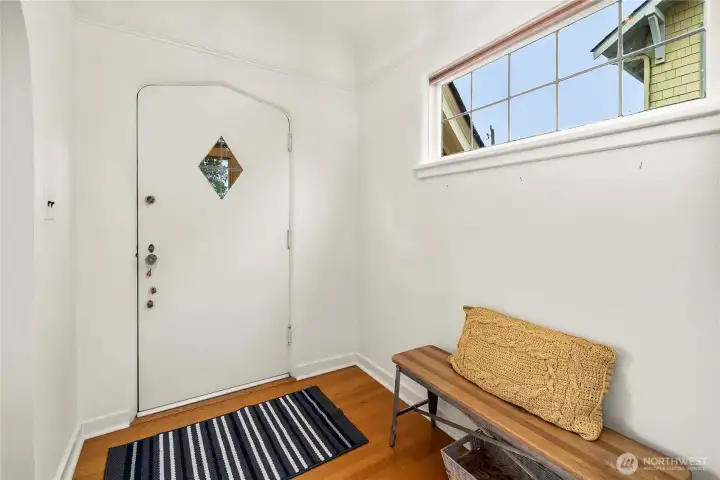 Enter the foyer which has easy access to living room, upper level, or the kitchen.