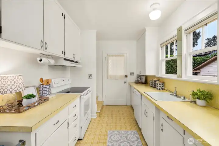 Returning to the kitchen we can exit through the backdoor to a mudroom to the backyard or the detached garage.