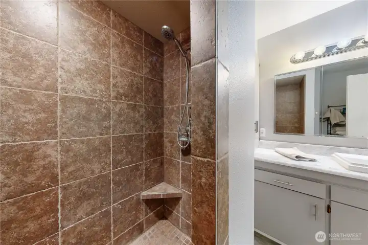 Primary Bathroom with tiled shower.