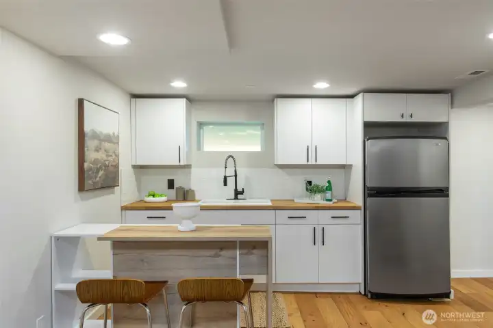 LOVE this kitchenette!  Potential to step up to a full kitchen.