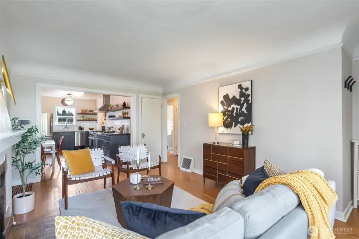 Seamless combo of original charm (leaded-glass, anchoring fireplace, coved ceilings) & contemporary updates  (swanky lighting fixtures, updated kitchen and baths).