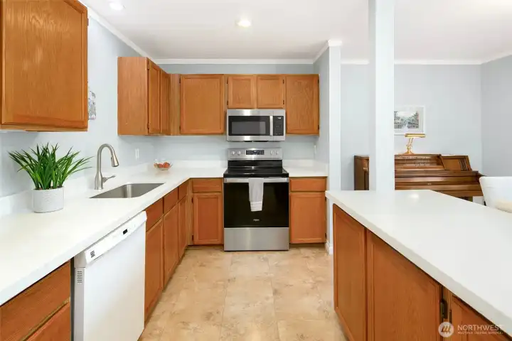 Updated kitchen with quartz counters and newer microwave and oven.