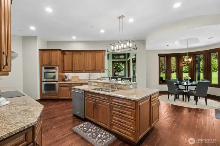 Perfect for daily living, the kitchen connects effortlessly to a bright, window-wrapped dining nook—bringing in natural light and peaceful views while keeping everyone close to the heart of the home.